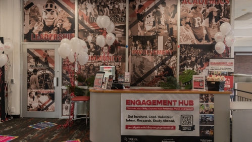 The Engagement Hub, flanked by balloons and merchandise