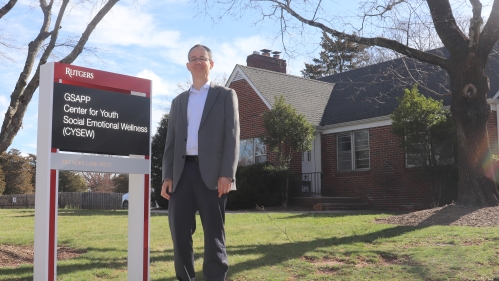 Dr. Joshua Langberg poses in front of the building housing the Center for Youth Social and Emotional Wellness (CYSEW)
