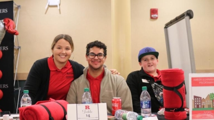 staff provide information during off-campus housing fair
