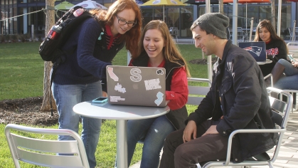 students studying outdoors at The Yard on College Ave campus