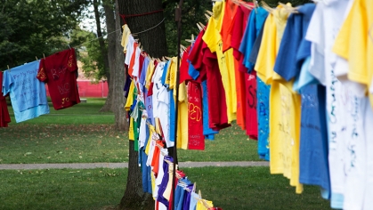 t-shirts hanging on a clothesline for the Clothesline Project