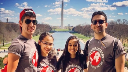 group of Rutgers students at reflection pool and Washington Monument in D.C.