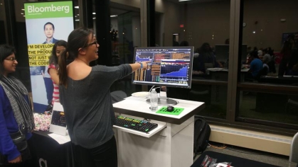 student points at computer screen