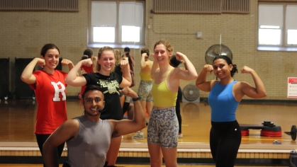 Sagar Singal, a Recreation class instructor, poses with his students after his class