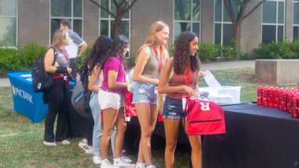 Students grab free merchandise at New Student Orientation