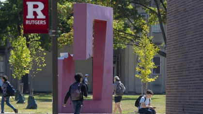 Student walking on Busch campus