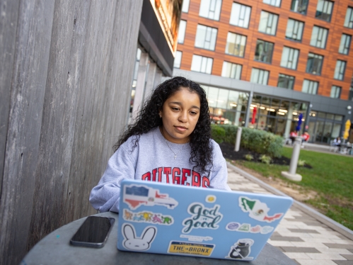 student on a laptop outdoors