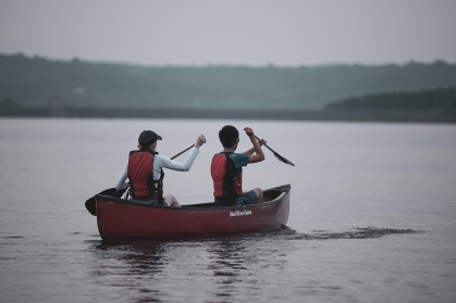 Two participants kayak during a GO Outdoors program