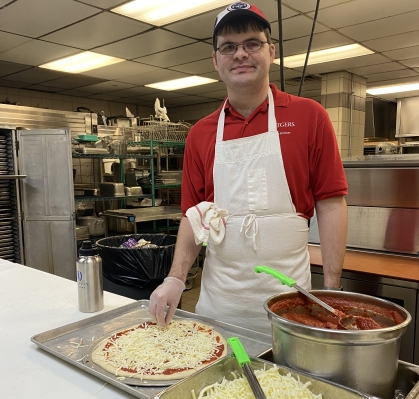 Scott makes a pizza at Busch Dining Hall