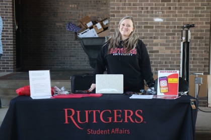 Amber Schreck tables at the Student Basic Needs table at a fall Farmers Market